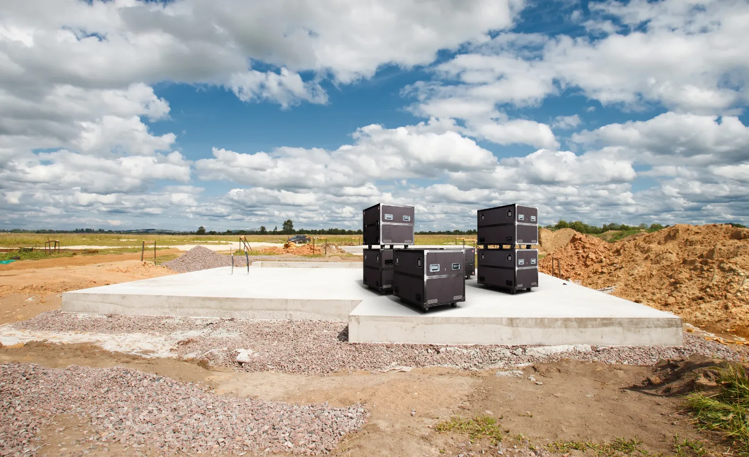 New concrete foundation slab curing on construction site – Concrete Pro Dallas